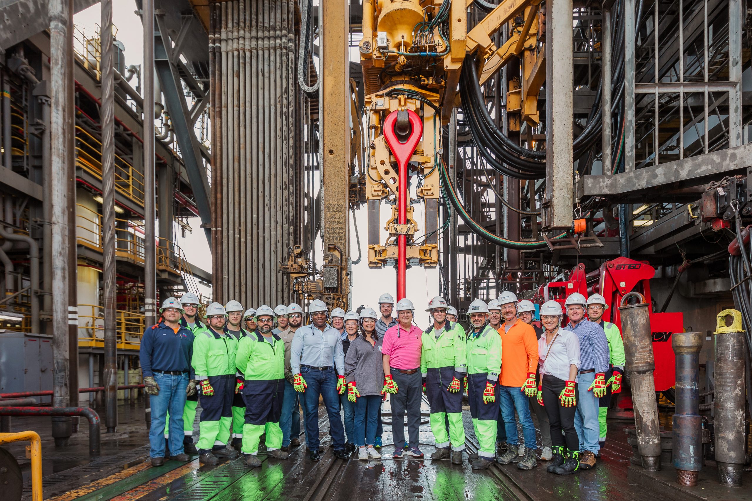 Crane hook next to a worker on an offshore drilling rig. : r